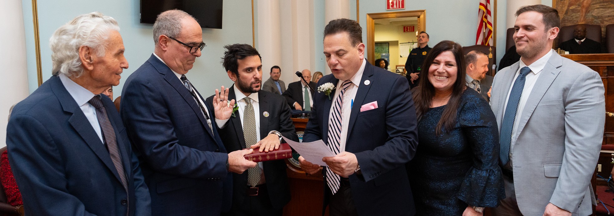 Commissioner Joe Signorello III is sworn in by Senate President Nick Scutari, with his family at his side