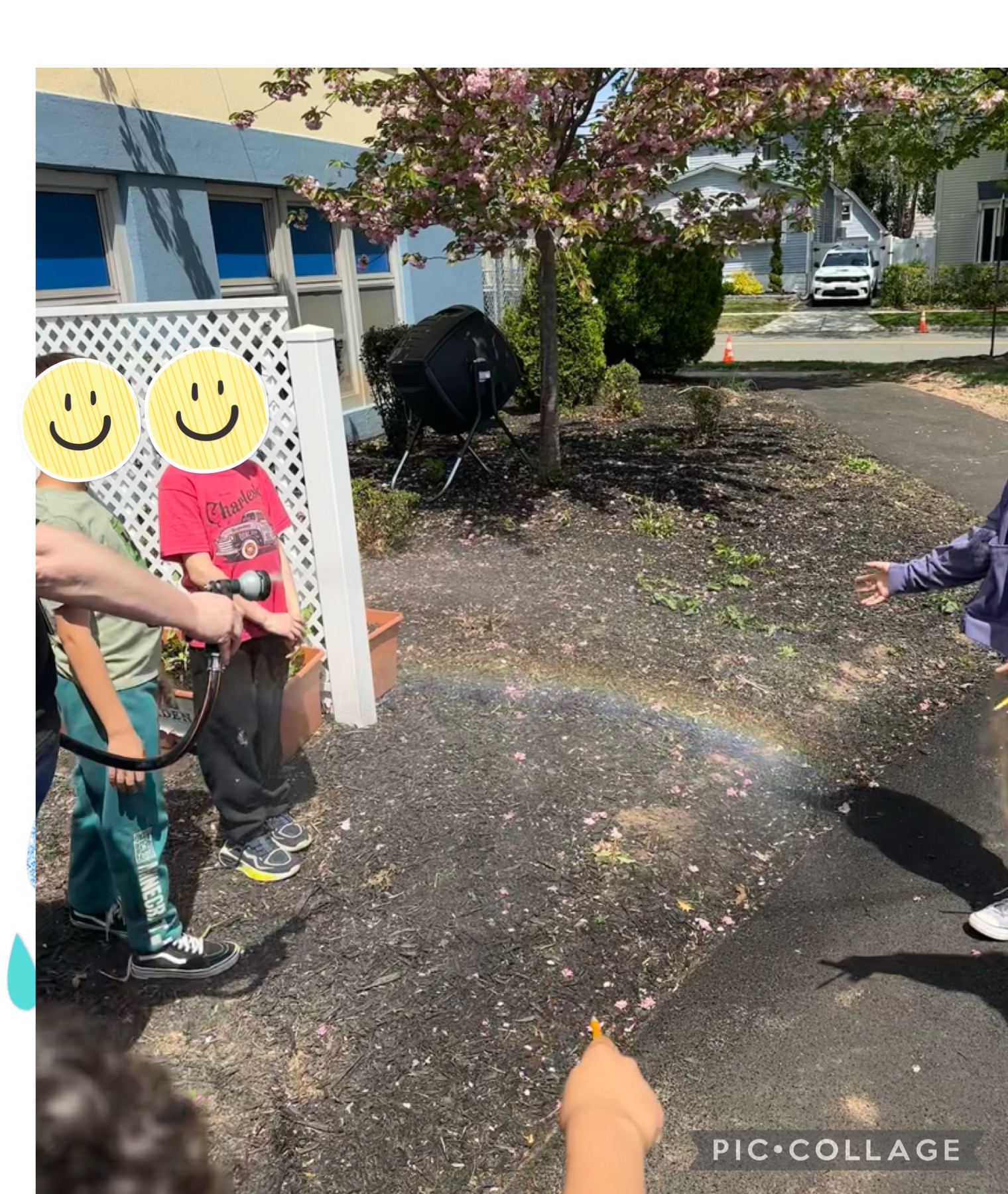 students with faces obscured showing the rainbow they found on the school grounds
