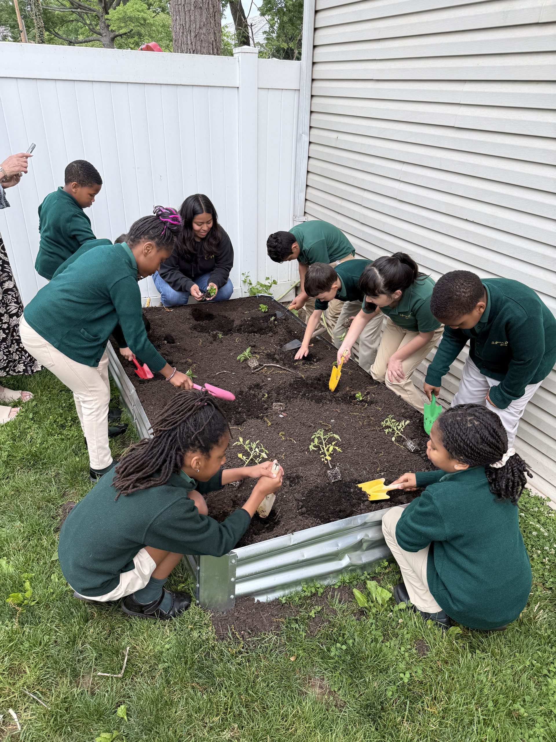 Students working together on their raised garden bed