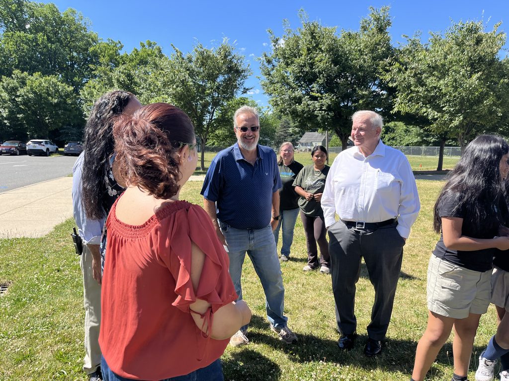 Chairman Bodek and school members planting a tree.