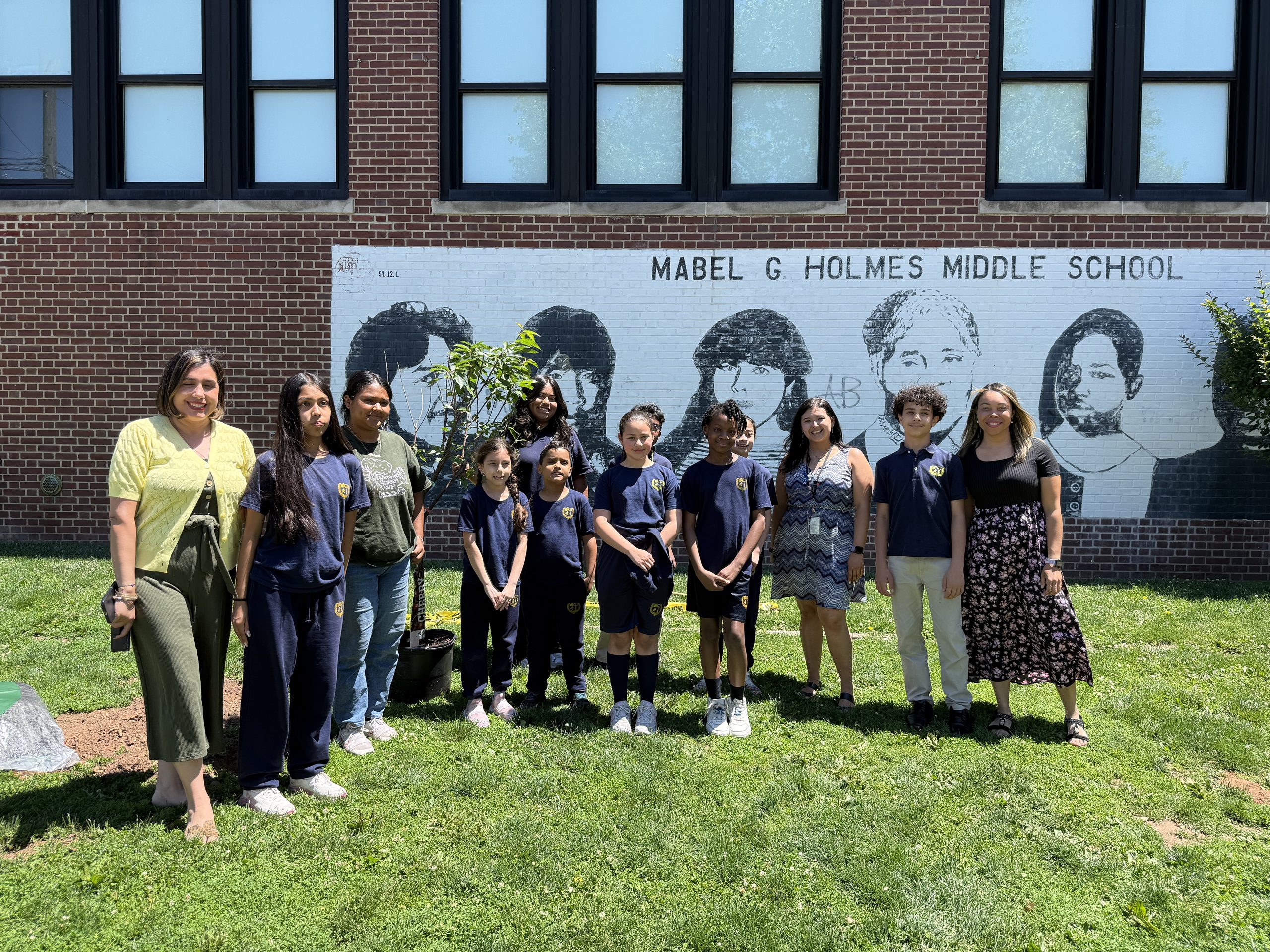 School No. 7 students, faculty, Groundworks Elizabeth staff and a Union County representative pose for a picture in front of the school