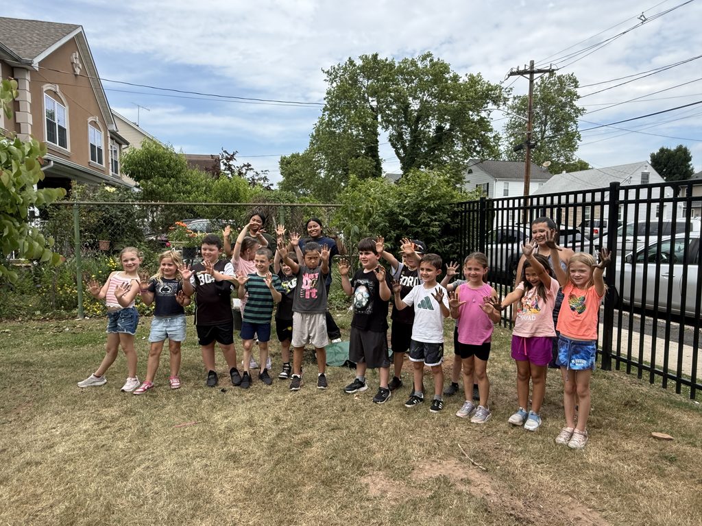Students planting a cherry tree.
