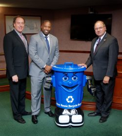 Union County Freeholder Chairman Bruce H. Bergen and Freeholders Mohamed S. Jalloh and Angel G. Estrada meet Curby the recycling robot. (Photo by Jim Lowney/County of Union)