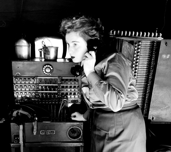 black and white image of a woman using a phone