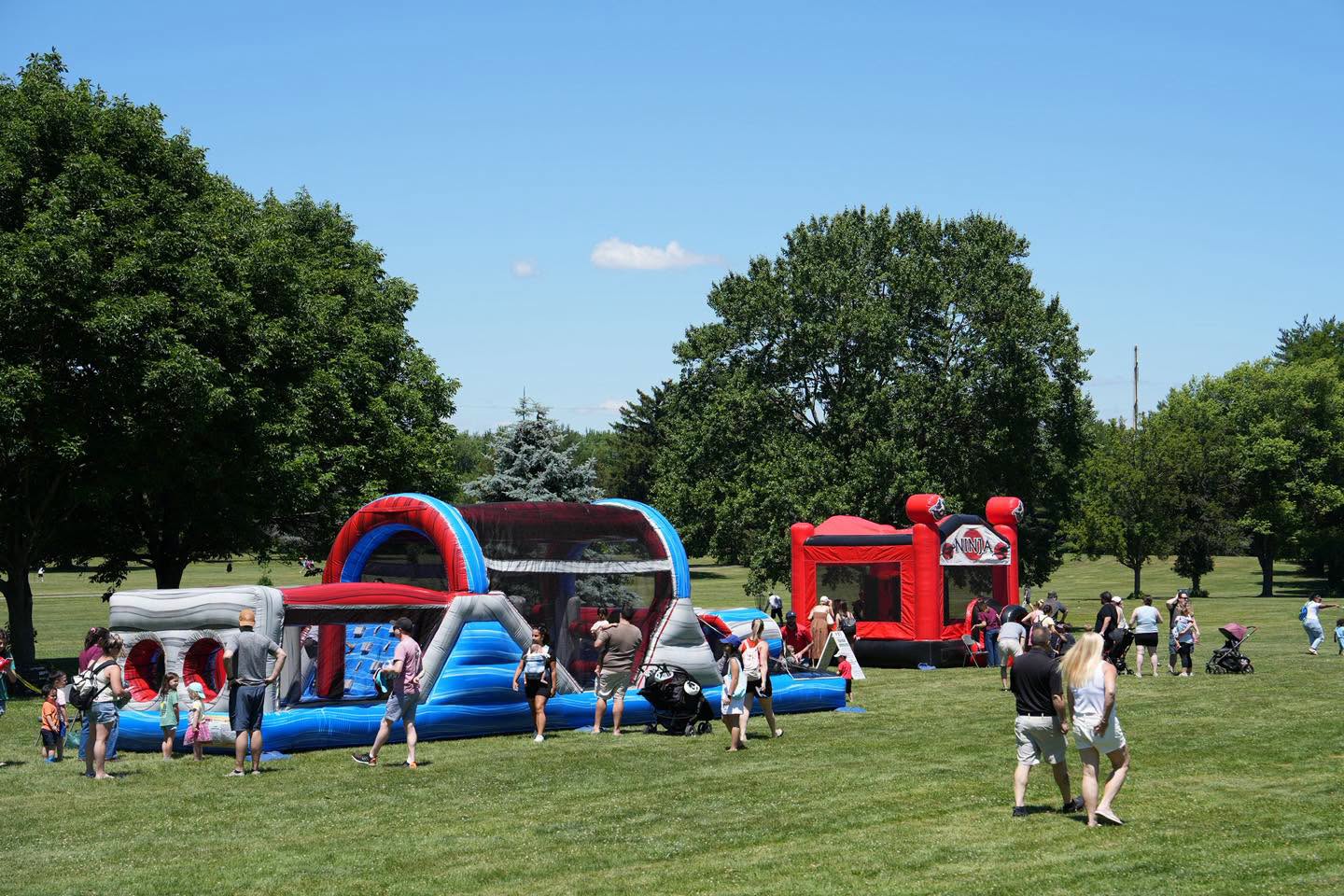 Photo of attendees enjoying various inflatables at the 2026 Touch-a-Truck event that took place on Saturday, June 13, 2026 at Oak Ridge Park in Clark