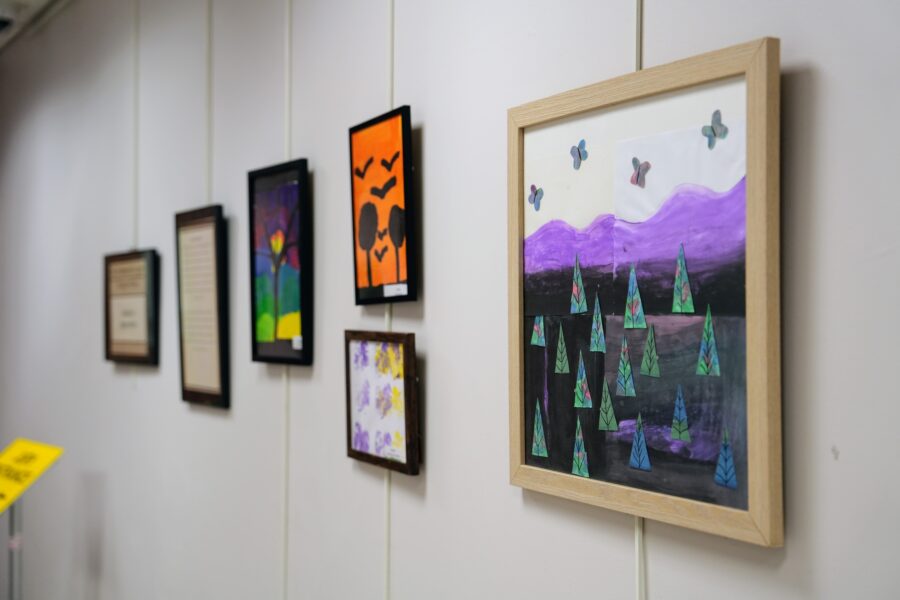 A photo of various artworks hanging in the Commissioners Gallery.