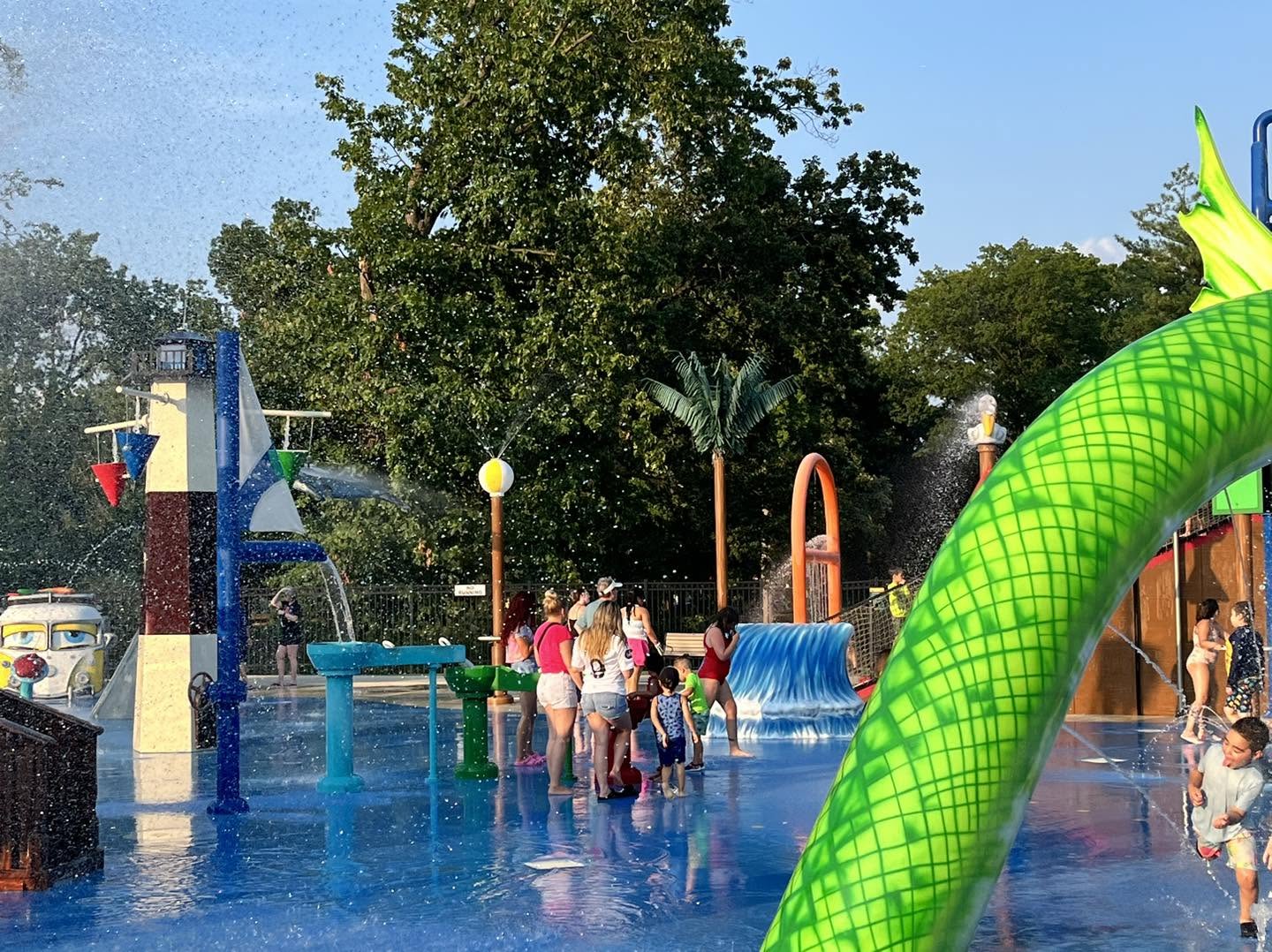 Image of residents and visitors at Wheeler Spray Park in Linden